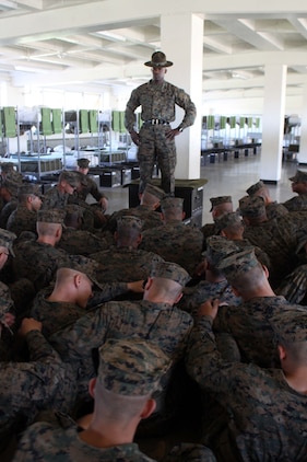 Staff Sgt. Antoine Griffith, senior drill instructor, Platoon 1031, Company B, sits his recruits down for some senior drill instructor time aboard Marine Corps Recruit Depot San Diego, Nov. 1. Griffith used the time to discuss what the recruits needed to do in order to be successful during a series commander inspection. 