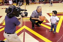 Cristian McGinnis, 3, completed his Tip-Off Kid responsibilities after handing the head referee the ball for the opening tip-off at the University of Minnesota men's basketball game at Williams Arena on Nov. 12. For additional imagery from the event, visit www.facebook.com/rstwincities.