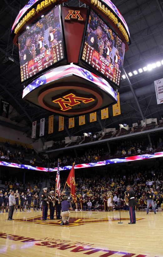 Marine musician Gunnery Sgt. Jason Knuckles kicks off the University of Minnesota men's basketball game with a rousing rendition of the National Anthem at Williams Arena on Nov. 12. For additional imagery from the event, visit www.facebook.com/rstwincities.