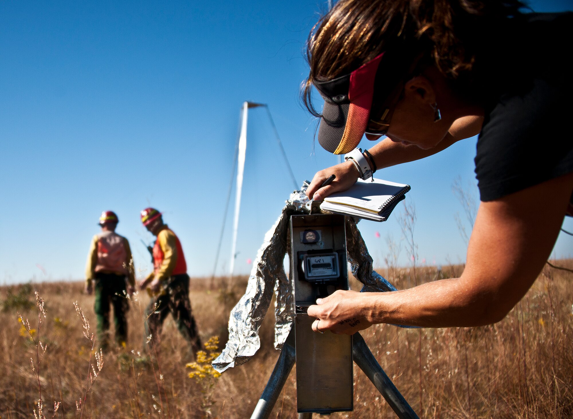 A member of the Combustion-Atmospheric-Dynamics-Research-Experiments team prepares the highly-instrumented plots prior to a prescribed fire conducted at Eglin Air Force Base Nov. 11-12. More than 90 scientists from the RxCADRE team, sent from institutions all over the world, set up instruments to record meteorology, smoke particulates and other fire phenomena. (U.S. Air Force photo/Randy Gon)