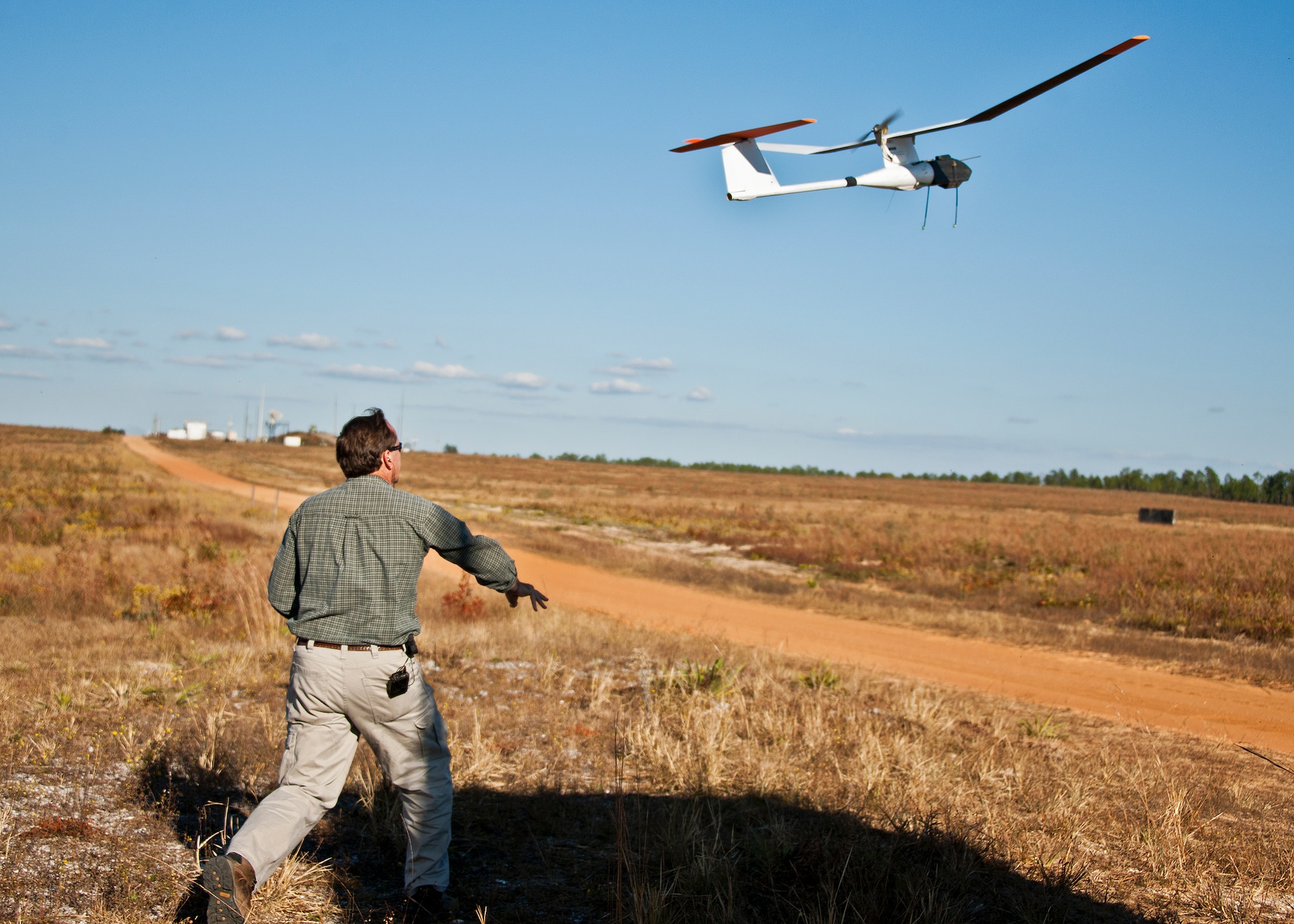 An unmanned aerial vehicle takes flight during a prescribed fire conducted at Eglin Air Force Base Nov. 11-12. More than 90 scientists from the Combustion-Atmospheric-Dynamics-Research-Experiments team, sent from institutions all over the world, set up instruments to record meteorology, smoke particulates and other fire phenomena. (U.S. Air Force photo/Randy Gon)
