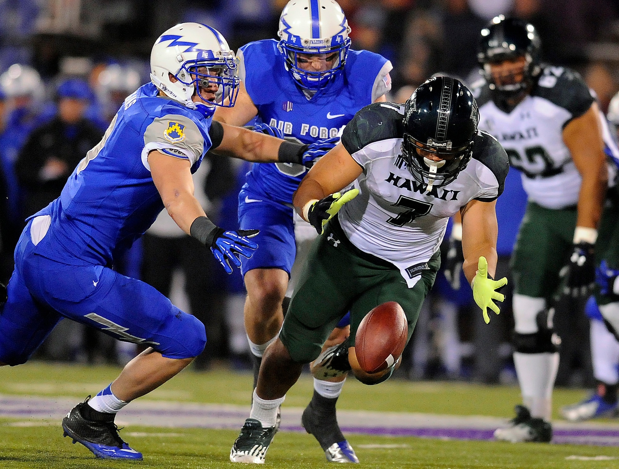 Hawai'i running back Joey Iosefa loses a fumble in the third quarter of the Air Force-Hawai'i game at Falcon Stadium Nov. 16, 2012. The Falcons defeated the Warriors, 21-7, without throwing a single pass. (U.S. Air Force photo/Mike Kaplan)
