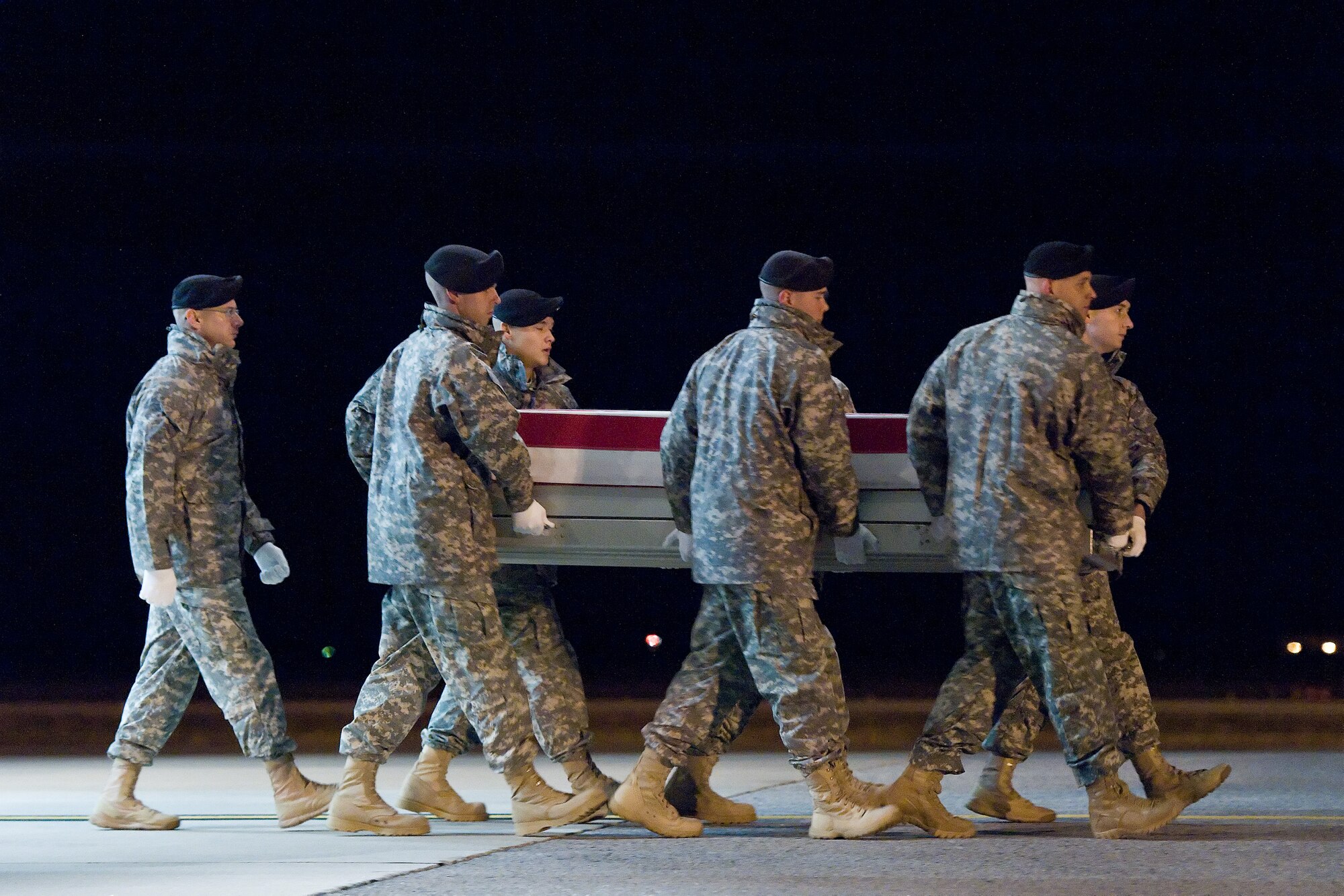 A U.S. Army carry team transfers the remains of Army Staff Sgt. Rayvon Battle Jr., of Rocky Mount, N.C., at Dover Air Force Base, Del., Nov. 17, 2012. Battle was assigned to the 38th Engineer Company, 4th Stryker Brigade Combat Team, 2nd Infantry Division, Joint Base Lewis-McChord, Wash. (U.S. Air Force photo/Roland Balik)