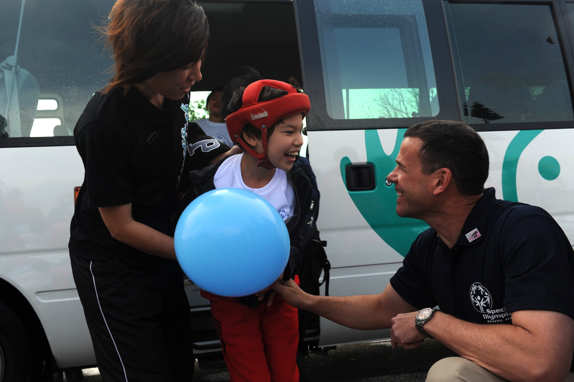 Brig. Gen. Matt Molloy, 18th Wing commander, greets special needs athletes and artists as they arrive at the Risner Fitness Center for the 13th annual Kadena Special Olympics on Kadena Air Base, Japan, Nov. 17, 2012. More than 5,000 people attended KSO festivities including nearly 1,000 American volunteers and 500 local national interpreters, along with senior officials from the Government of Japan, Okinawa Prefectural Government, local communities and the U.S. military. (U.S. Air Force photo/Airman 1st Class Hailey Davis)