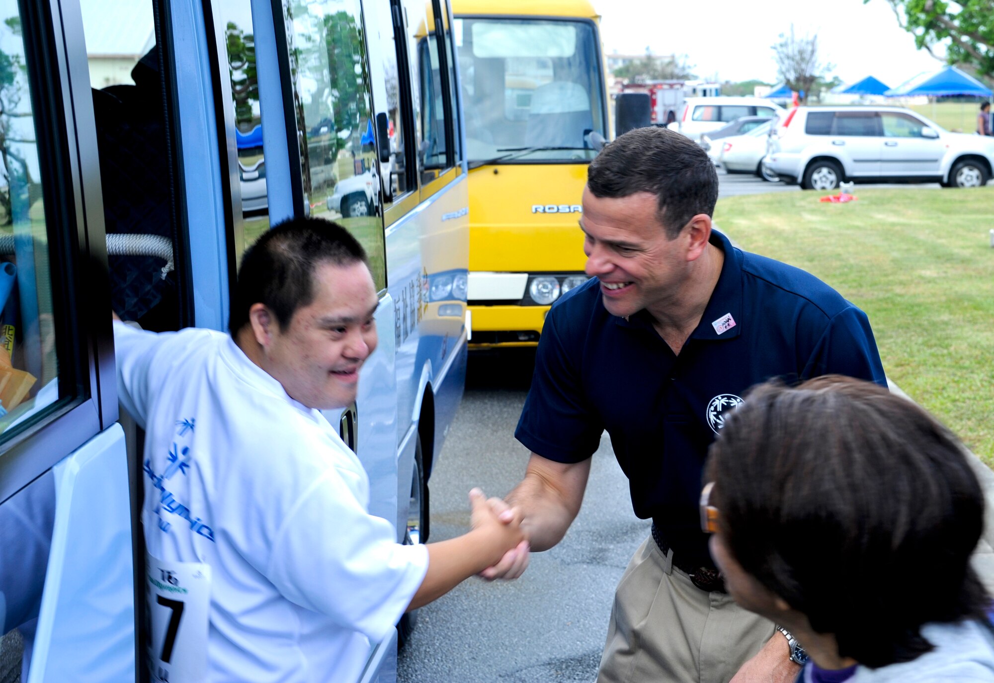 U.S. Air Force Brig. Gen. Matt Molloy, 18th Wing commander, greets a special-needs athlete during the beginning of the 13th annual Kadena Special Olympics on Kadena Air Base, Japan, Nov. 17, 2012. More than 5,000 people attended KSO festivities including nearly 1,000 American volunteers and 500 local national interpreters, along with senior officials from the Government of Japan, Okinawa Prefectural Government, local communities and the U.S. military. (U.S. Air Force photo/Airman 1st Class Justin Veazie)