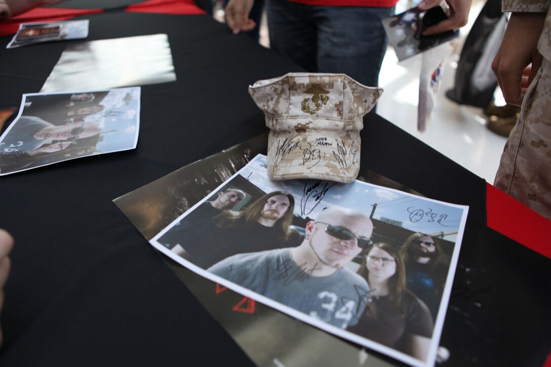 Marines gathered to have posters, uniform caps, guitars and other items signed by members of leading metal rock band All That Remains at the Marine Corps Exchange aboard Marine Corps Base Camp Lejeune recently. The band shared quick conversations and handshakes with members of the military.  