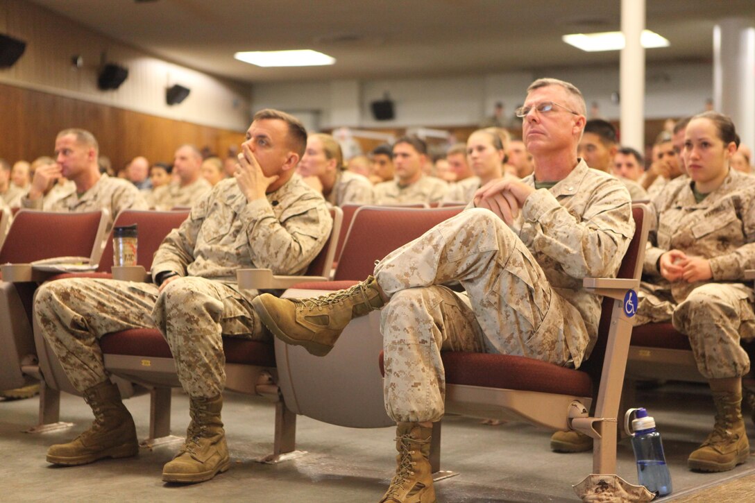 Lt. Col. David G. Bardorf, the commanding officer of Marine Corps Istallations East-Marine Corps Base Camp Lejeune's Headquarters and Support Battalion, and Sgt. Maj. Michael J. Rowan, the battalion sergeant major, listen to a presentation during the Sexual Assault Prevention and Response all-hands training held at the base theater Oct. 16. Bardorf and Rowan spoke throughout the presentation as well as other key players in the battalion’s response to sexual assault.