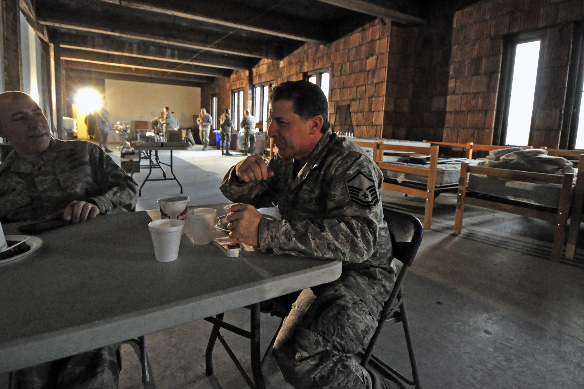 Master Sgt. Steven Sabato, 108th Wing, New Jersey Air National Guard, takes a small break from his duties at the shelter location in Jersey City, Nov. 7 to eat some breakfast. The New Jersey National Guard is providing sheltering for displaced Jersey City residents at the Jersey City armory in the aftermath of Hurricane Sandy. (U.S. Air Force photo by Staff Sgt. Armando Vasquez/Released)