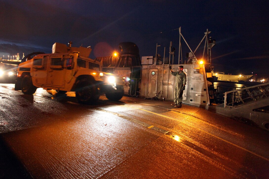 Marines and Sailors with the 24th Marine Expeditionary Unit offload military vehicles from a Navy Landing Craft Air Cushion hovercraft in preparation for wash down procedures aboard Naval Station Rota, Spain, Nov. 11, 2012. Marines conducted the wash down to clean dirt and debris from their vehicles and equipment in preparation for their scheduled return to their home bases in North Carolina later this year. The 24th MEU is deployed with the Iwo Jima Amphibious Ready Group and is currently in the 6th Fleet Area of Responsibility as a disaster relief and crisis response force. Since deploying in March, they have supported a variety of missions in the U.S. Central and European Commands, assisted the Navy in safeguarding sea lanes, and conducted various bilateral and unilateral training events in several countries in the Middle East and Africa. 