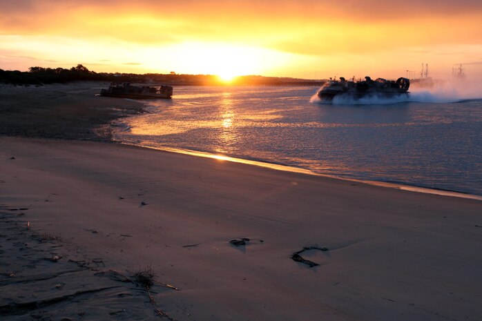 A Landing Craft Air Cushion hovercraft lands on the beach at Naval Station Rota, Spain, to offload military vehicles and equipment from the 24th Marine Expeditionary Unit in preparation for wash down procedures, Nov. 11, 2012. Marines conducted the wash down to clean dirt and debris from their vehicles and equipment in preparation for their scheduled return to their home bases in North Carolina later this year. The 24th MEU is deployed with the Iwo Jima Amphibious Ready Group and is currently in the 6th Fleet Area of Responsibility as a disaster relief and crisis response force. Since deploying in March, they have supported a variety of missions in the U.S. Central and European Commands, assisted the Navy in safeguarding sea lanes, and conducted various bilateral and unilateral training events in several countries in the Middle East and Africa.
