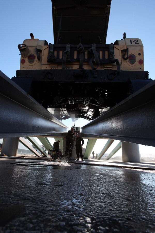 A Marine with 24th Marine Expeditionary Unit sprays the undercarriage of a Humvee during wash down procedures aboard Naval Station Rota, Spain, Nov. 11, 2012. Marines conducted the wash down to clean dirt and debris from their vehicles and equipment in preparation for their scheduled return to their home bases in North Carolina later this year. The 24th MEU is deployed with the Iwo Jima Amphibious Ready Group and is currently in the 6th Fleet Area of Responsibility as a disaster relief and crisis response force. Since deploying in March, they have supported a variety of missions in the U.S. Central and European Commands, assisted the Navy in safeguarding sea lanes, and conducted various bilateral and unilateral training events in several countries in the Middle East and Africa. 