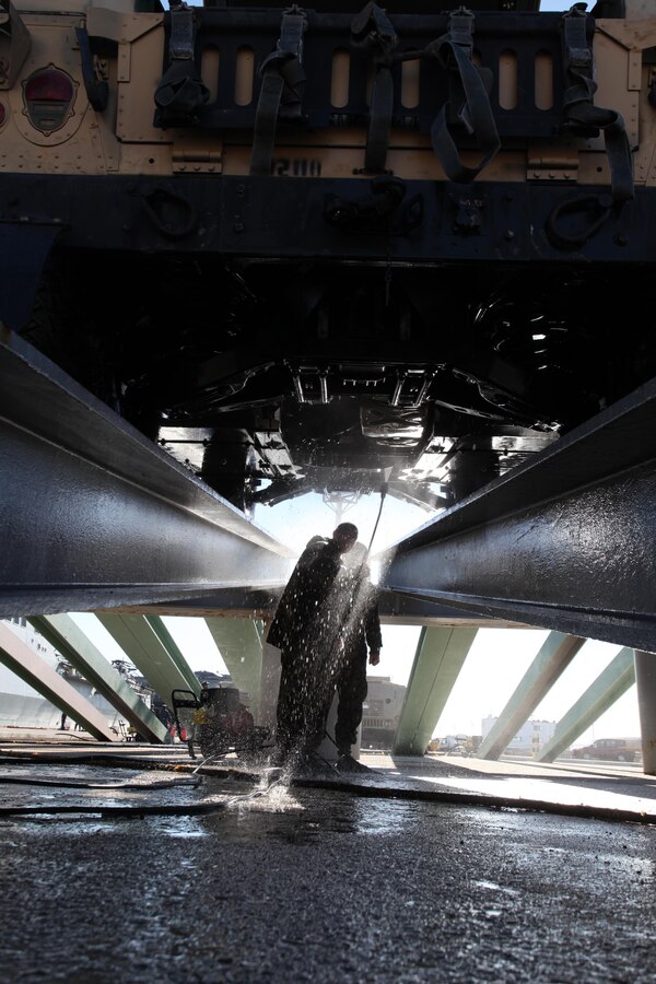 A Marine with 24th Marine Expeditionary Unit sprays the undercarriage of a Humvee during wash down procedures aboard Naval Station Rota, Spain, Nov. 11, 2012. Marines conducted the wash down to clean dirt and debris from their vehicles and equipment in preparation for their scheduled return to their home bases in North Carolina later this year. The 24th MEU is deployed with the Iwo Jima Amphibious Ready Group and is currently in the 6th Fleet Area of Responsibility as a disaster relief and crisis response force. Since deploying in March, they have supported a variety of missions in the U.S. Central and European Commands, assisted the Navy in safeguarding sea lanes, and conducted various bilateral and unilateral training events in several countries in the Middle East and Africa.