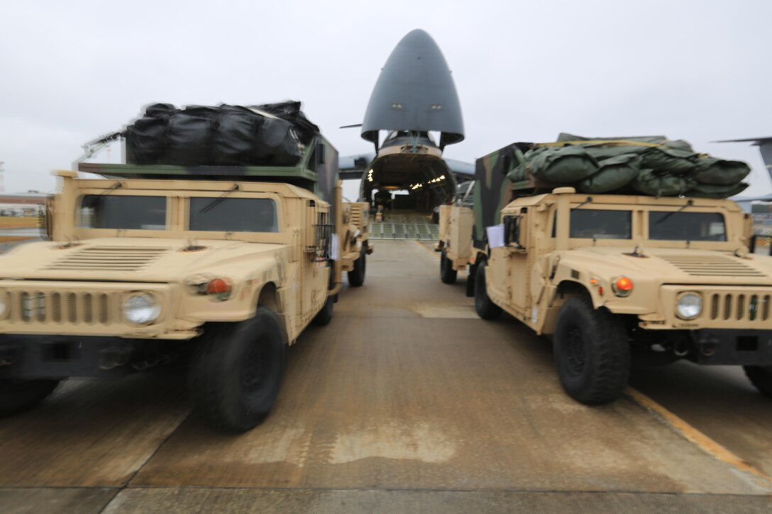 Marines with the 24th Marine Expeditionary Unit offload tactical vehicles at Marine Corps Air Station Cherry Point N.C., Nov. 13, 2012, as they return from an eight-month deployment. The Marines are part of the 24th MEU's Joint Task Force Enabler, or JTFE, section, which was responsible for the coordination of communications assets throughout the entire 24th MEU, both on land and at sea. They were deployed to Naval Air Station Sigonella, Italy.