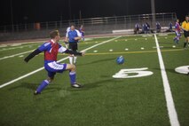 Yirak Seth, Marine Corps Air Station New River Blues' right midfielder, plays a long pass during the Blues' double-overtime loss to Navy Hospital which ended 3-2, Nov. 14.