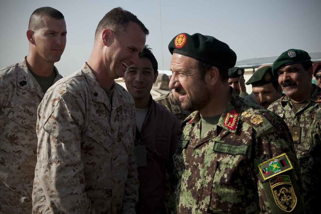 U.S. Marine Corps Lt. Col. Lawrence Huggins (left), commander, Special Operations Task Force - West, speaks with Maj. Gen. Taj Mohammed Jahed, commander, 207th Afghan National Army Corps, before a ribbon cutting ceremony for new facilities on 9th Commando's base in Herat, Afghanistan, Oct. 11, 2012. Afghan National Security Forces, partnered with coalition forces, are preparing to be the lead security force for the people of the Islamic Republic of Afghanistan. (Official U.S. Marine Corps photo by Sgt. Pete Thibodeau/Released)