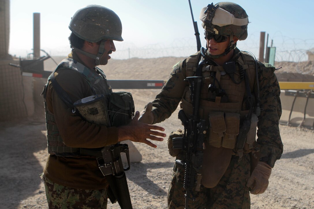 Afghan National Army Sgt. Gulagh, left, squad leader, 1st Tolai, 1st Kandak, 4th Brigade, 215th Corps, thanks Sgt. Cordero Gonzalez, squad leader, Lima Company, 3rd Battalion, 9th Marines, Regimental Combat Team 7, after their partnered patrol, Nov. 16, 2012. Gonzalez worked as an advisor to Gulagh, making suggestions but allowing Gulagh to command his own soldiers.