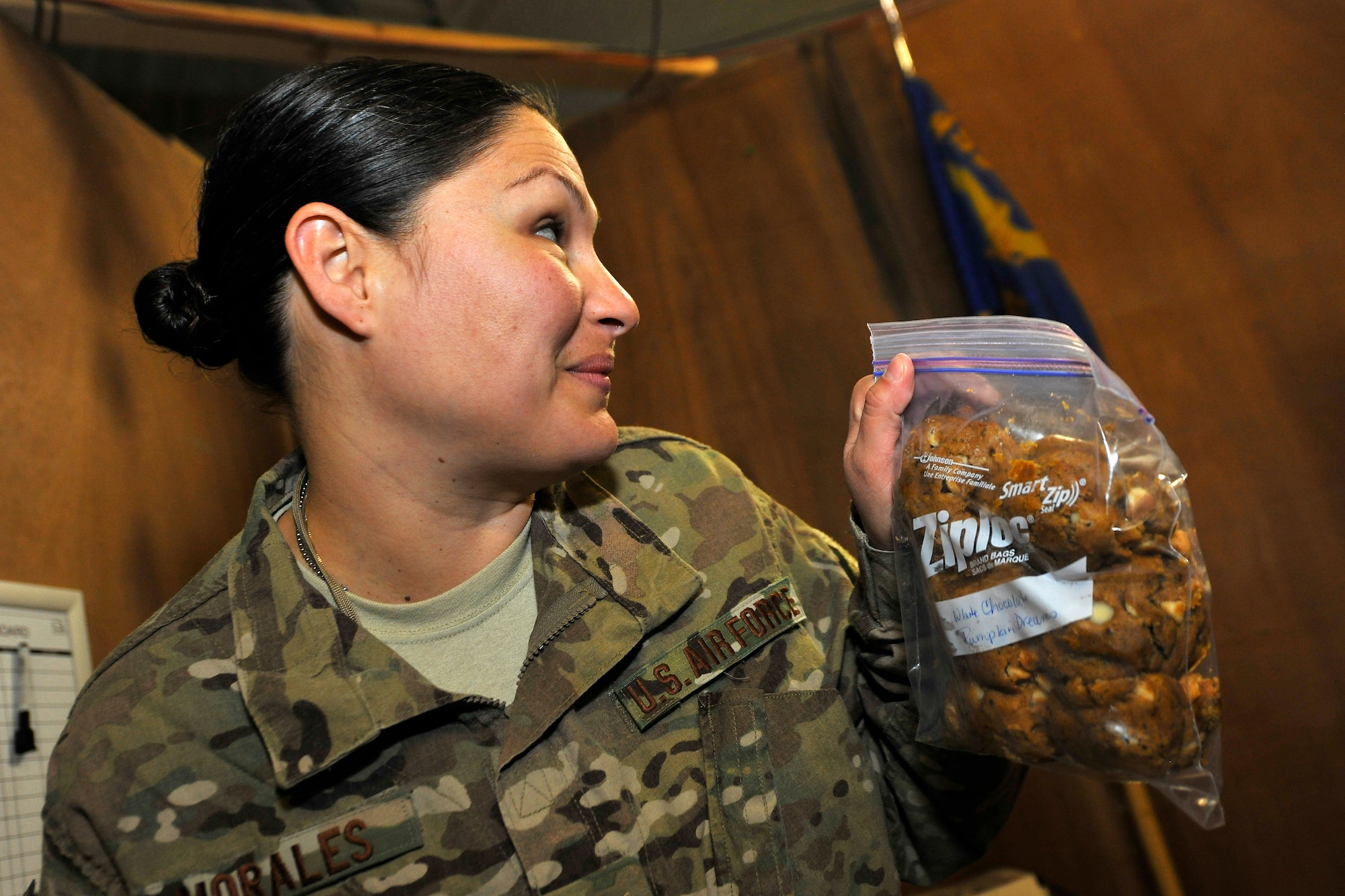 Staff Sgt. Cynthia Morales, 455th Expeditionary Mission Support Group commander’s executive administrator, offers her co-workers the home-baked cookies she just received in a care package at Bagram Airfield, Afghanistan, Nov. 19, 2012.  Members of the knowledge operations management office dedicate themselves, day-in and day-out, to provide an appreciated service to 455th Air Expeditionary Wing by keeping the mail flowing. (U.S. Air Force photo/Senior Airman Chris Willis)