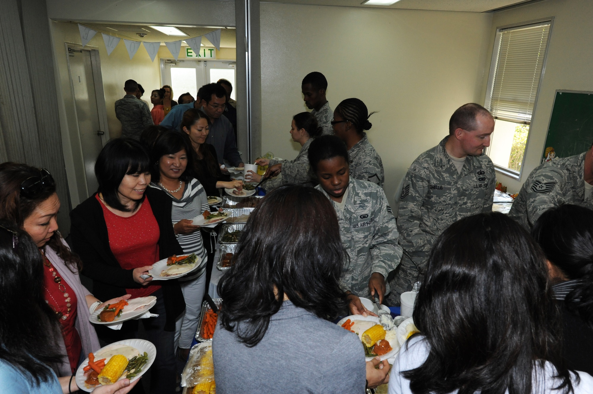 Kadena's chapel team serves a Thanksgiving meal at Chapel 1 on Kadena Air Base, Japan, Nov. 20, 2012. Chapel members held the lunch to show the Japanese civilians some Thanksgiving traditions like spending time with family and friends. (U.S. Air Force photo/Airman 1st Class Malia Jenkins)