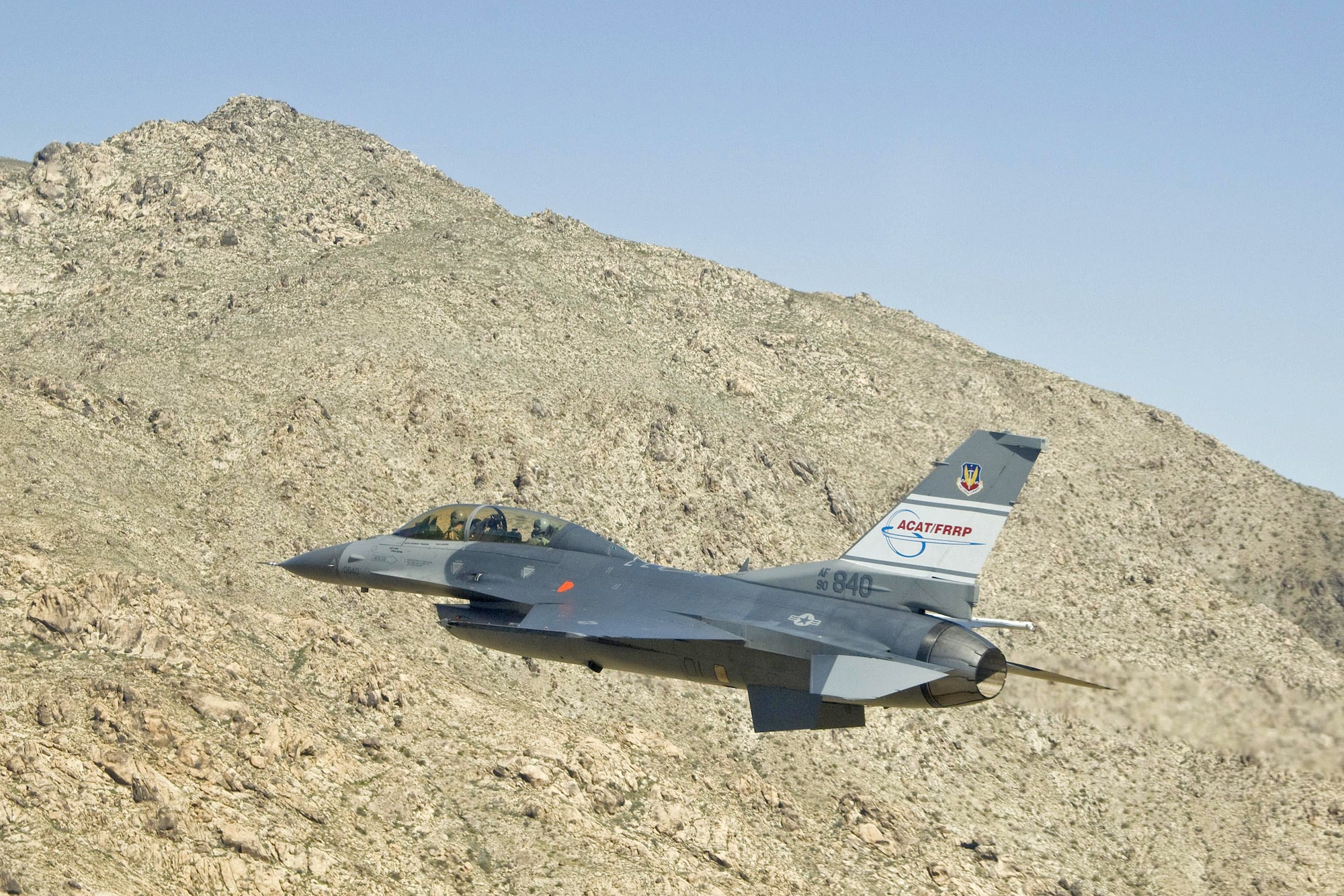 The U.S. Air Force's F-16D, tail #840, Automatic Collision Avoidance Technology aircraft crew takes a close look at a Mojave Desert hill during a March 2009 test flight. NASA’s Dryden Flight Research Center worked with the Air Force Research Laboratory in the ACAT Fighter Risk Reduction Project to develop collision avoidance technologies for fighter/attack aircraft that would reduce the risk of ground and mid-air collisions.(Photo by Jim Ross/NASA)