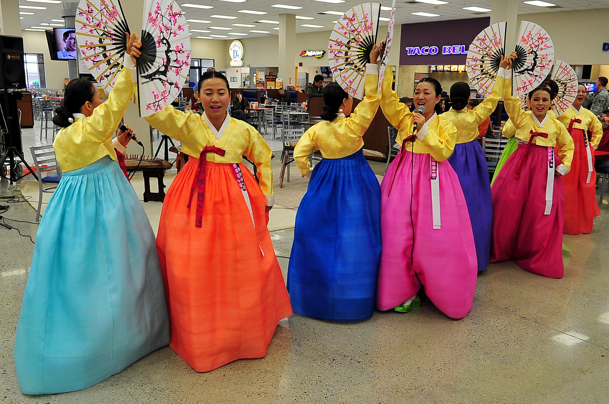 Korean folk dancers perform during the Brand Opening of the Osan Exchange Nov. 16, 2012 at Osan Air Base, Republic of Korea. Performances by Korean rap stars, Tasha Reid, or Yoon Mirae, and Tiger J.K., or Drunken Tiger, and a Korean folk dancing team entertained the crowds. (U.S. Air Force photo/Tech. Sgt. Raymond Mills) 
