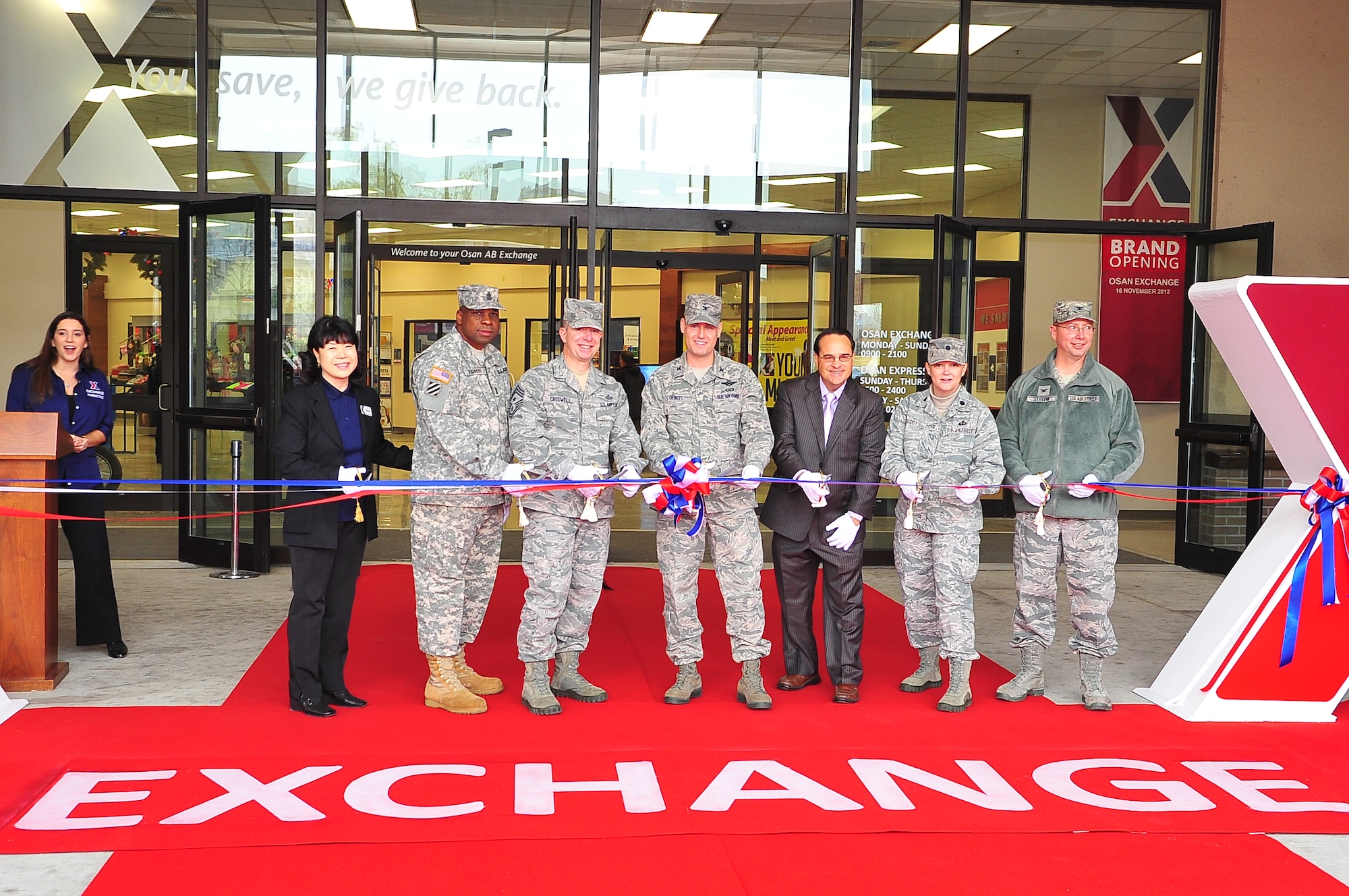 Leaders from the 51st Fighter Wing and the Army and Air Force Exchange Service cut the ribbon during the opening of the newly rebranded Exchange Nov. 16, 2012, at Osan Air Base, Republic of Korea. Osan is the first base in Pacific Air Forces to receive the upgrade. (U.S. Air Force photo/Tech. Sgt. Raymond Mills)
