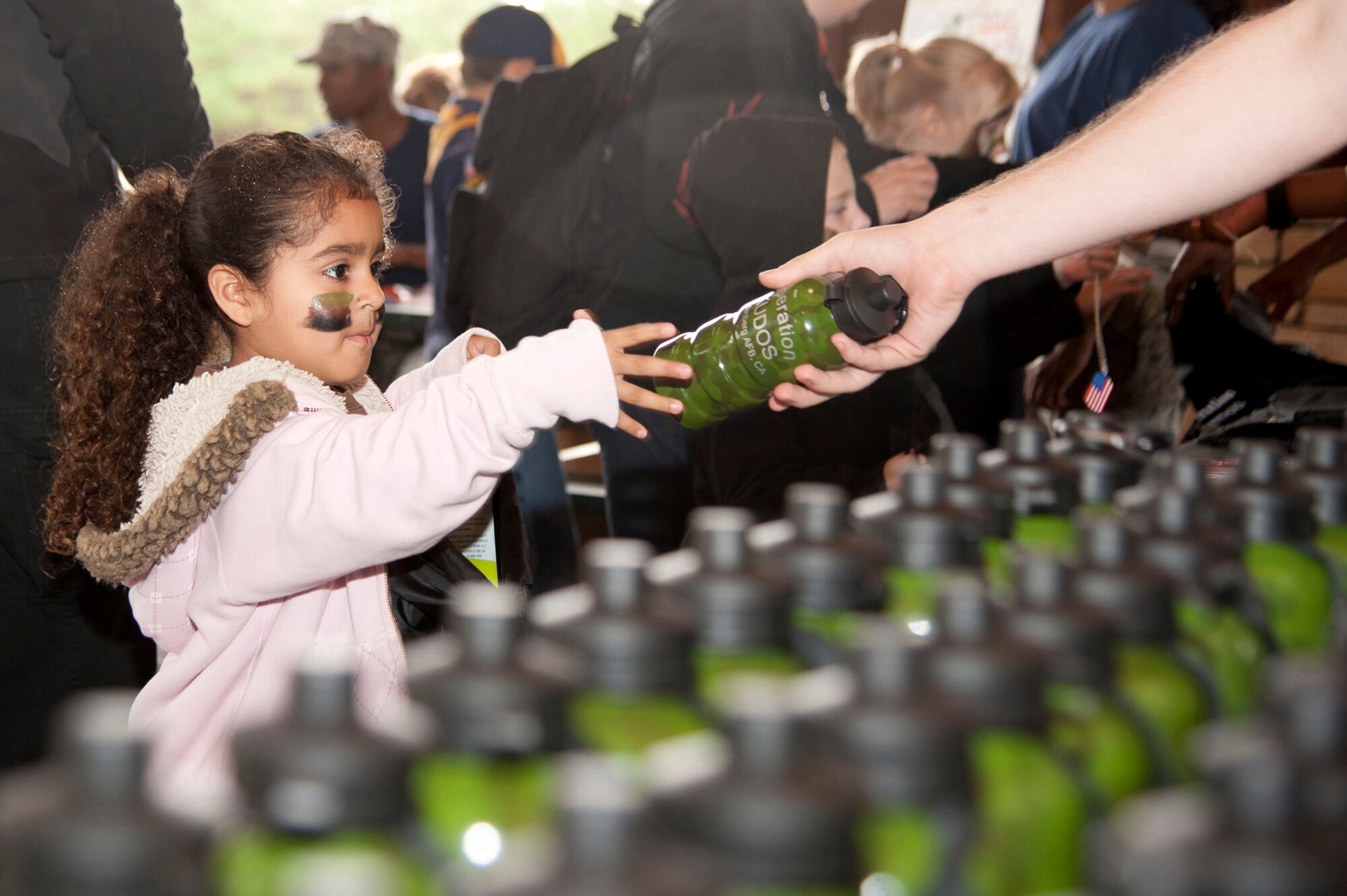 VANDENBERG AIR FORCE BASE, Calif. – Approximately 52 children processed through a deployment line to receive gear and briefings during a Kids Understanding Deployments Operations event at Cocheo Park here Saturday, Nov. 17, 2012. KUDOS simulated a deployment processing line for dependents to help them understand the deployment process their parents or guardians go through before deployment. (U.S. Air Force photo/Senior Airman Lael Huss)