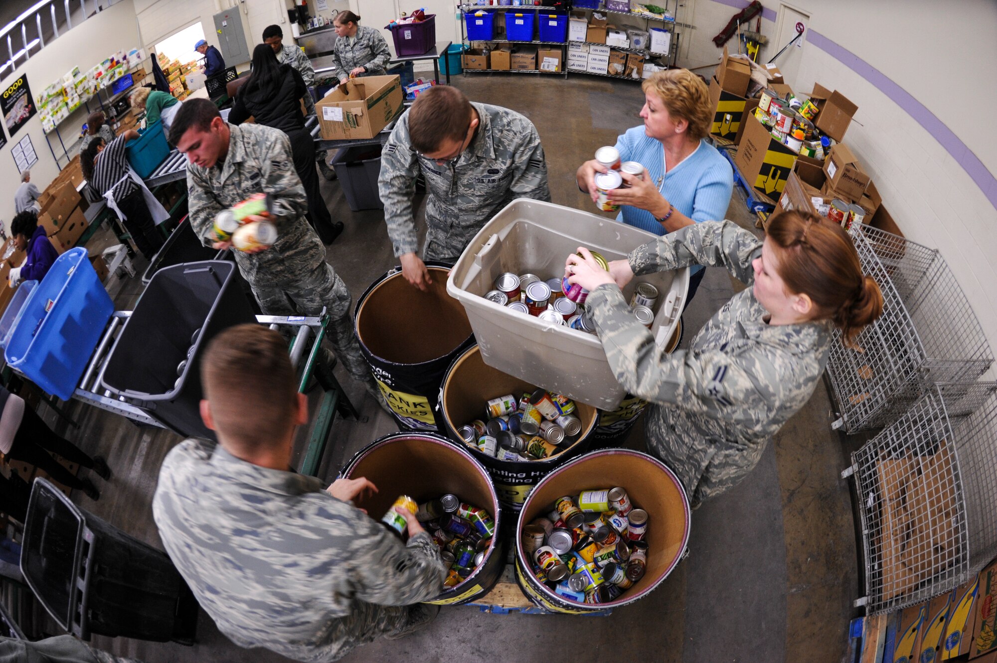 DENVER – 460th Operations Group volunteers from Buckley Air Force Base sort food Nov. 19, 2012 at the Food Bank of the Rockies. About 20 Airmen, civilians and family members from the 460th OG volunteered at the food bank, which provides food for more than 350,000 people annually, according to the FBR web site. (U.S. Air Force photo by Senior Airman Christopher Gross)
