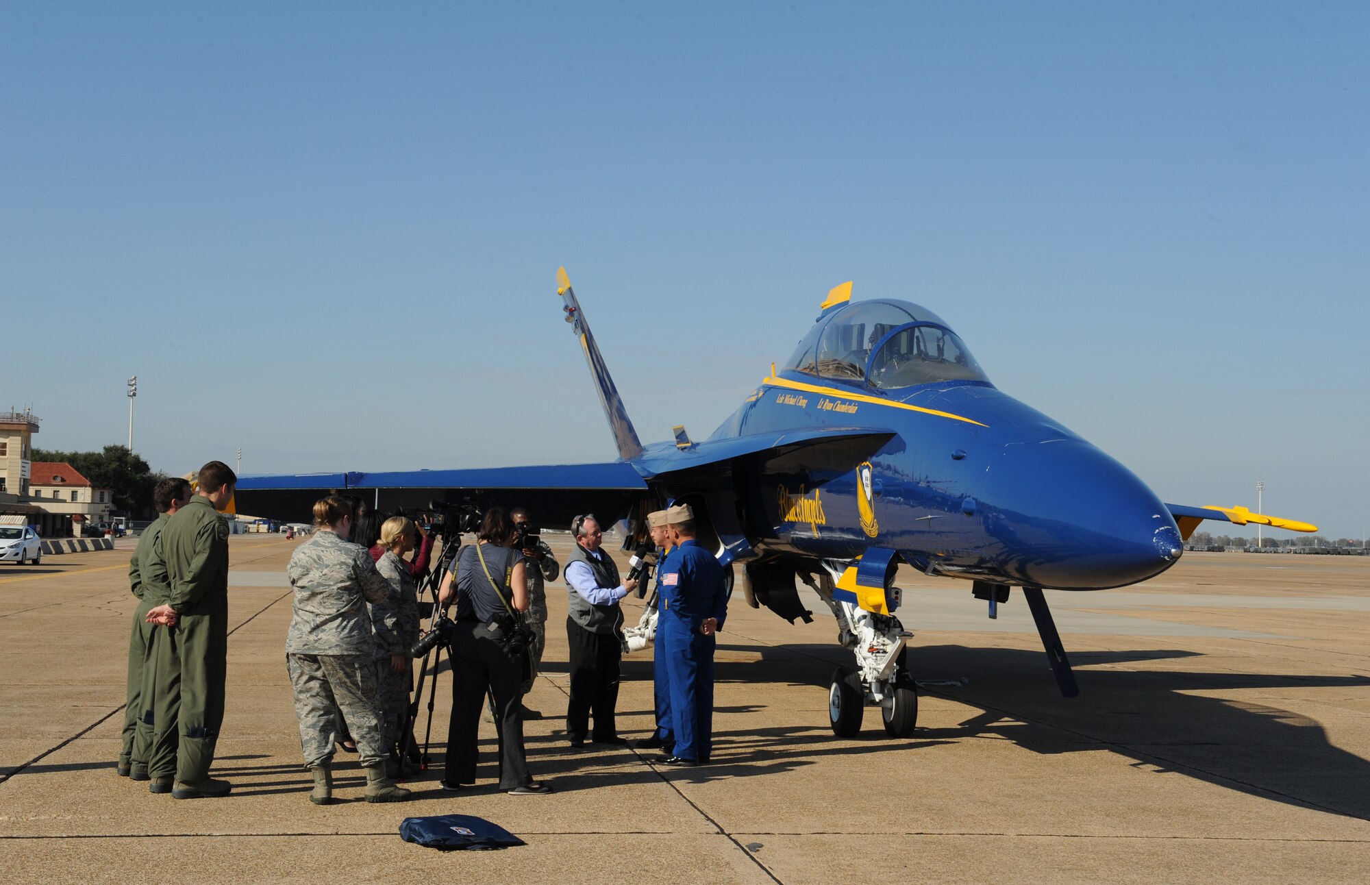 United States Navy Flight Demonstration Team Blue Angels aircrew members are interviewed by the local media on Barksdale Air Force Base, La., Nov. 19. U.S. Navy Lt. Ryan Chamberlain and Lt. Cmdr. Michael Cheng visited Barksdale to start preliminary preparations with base organizations for the 2013 Defenders of Liberty Airshow scheduled for May 4-5. (U.S. Air Force Photo/Airman 1st Class Benjamin Gonsier)(RELEASED)
