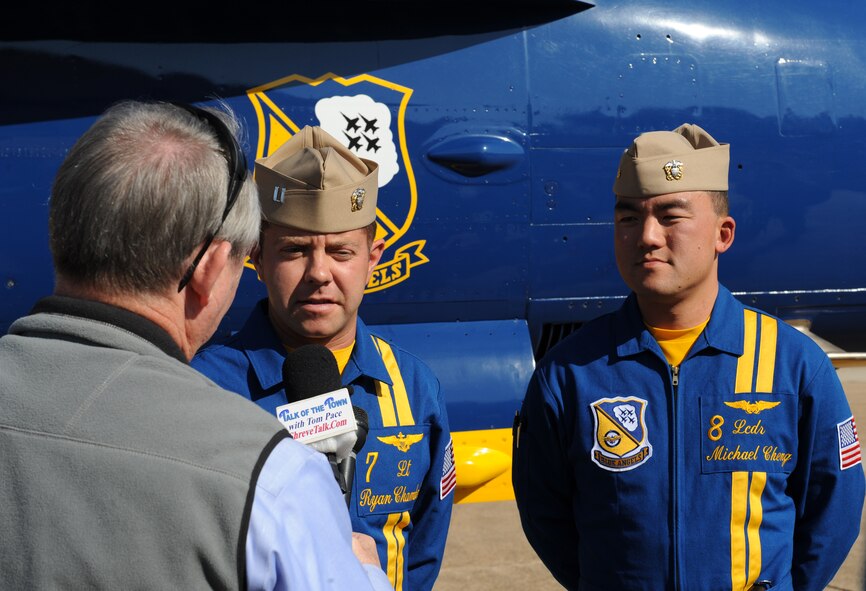 U.S. Navy Lt. Ryan Chamberlain and Lt. Cmdr. Michael Cheng, United States Navy Flight Demonstration Team Blue Angels, are interviewed by the local media on Barksdale Air Force Base, La., Nov. 19. Chamberlain and Cheng visited Barksdale to start preliminary preparations with base organizations for the 2013 Defenders of Liberty Airshow scheduled for May 4-5. (U.S. Air Force Photo/Airman 1st Class Benjamin Gonsier)(RELEASED)