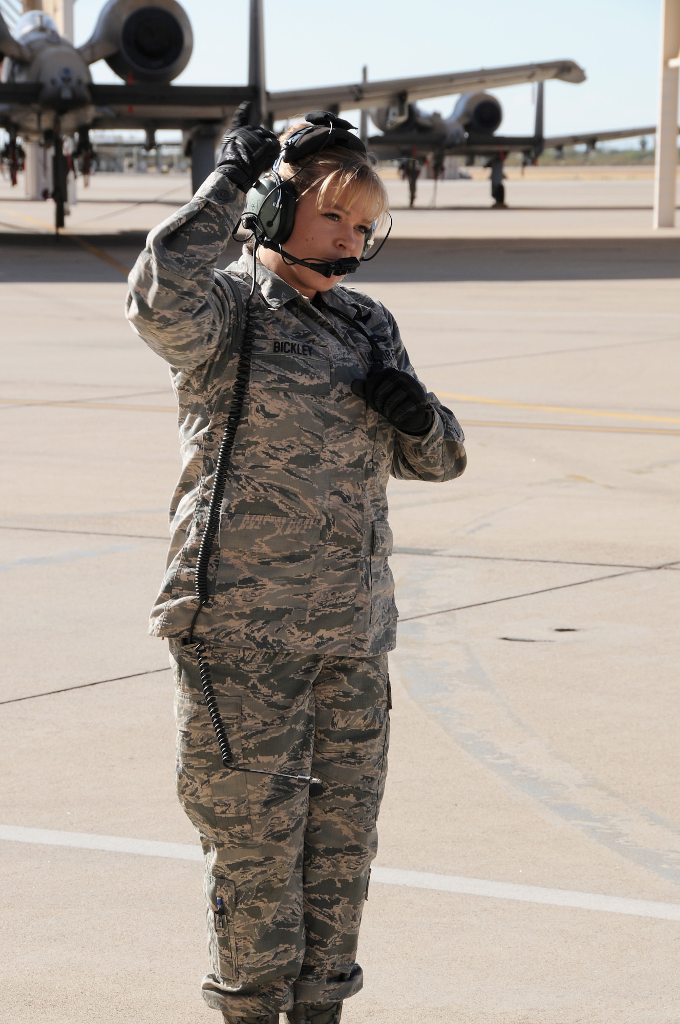 Staff Sgt. Heather Bickley, crew chief, 924th Maintenance Squadron, Davis Monthan AFB, Ariz., marshals her A-10 pilot out of his parking spot for a historic first flight November 3. The fully operational 924th Fighter Group is now able to add critical weekend flying hours to the schedule. (U.S. Air Force Photo by Tech. Sgt. Louis Vega)