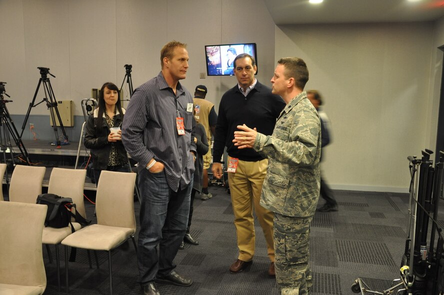 Lt. Col. Benjamin Forest, 344th Recruiter Squadron commander, speaks with AFA graduate and former Dallas Cowboy Chad Hennings, as well as former Dallas Cowboy John Gesek on Nov. 18 in Arlington, Texas. (U.S. Air Force photo/Master Sgt. Dustin Beard) 