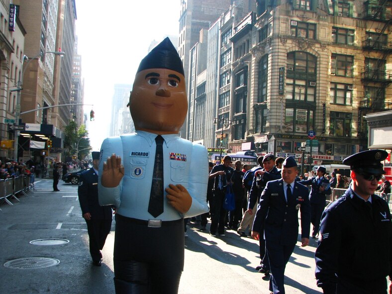 Recruiters from the 313th Recruiting Squadron, led by the A-10 "Carthog," and members of the Air Force Delayed Entry Program make their way down 5th Avenue in the New York City Veterans Day Parade Nov. 11, 2012. They joined other veterans, civic groups and active duty military members to honor all veterans who have served over the nation's history. The United War Veterans Council, which organized the parade, also used the opportunity to collect relief donations and winter coats for the victims of Hurricane Sandy.(U.S. Air Force photo/ Staff Sgt. Sean Triglia)