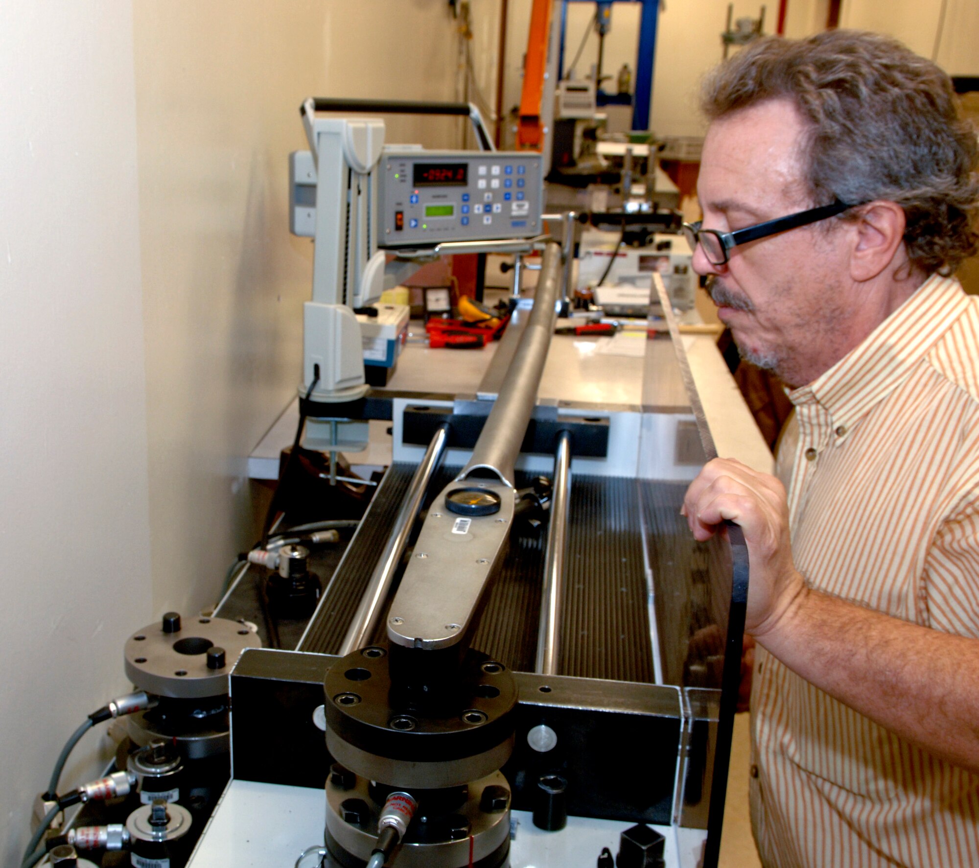 Doug Elder, Precision Measurement Equipment Laboratory technician, calibrates a 1,000 foot pound torque wrench on Barksdale Air Force Base, La., Nov. 7. Technicians at the PMEL lab calibrate more than 7,500 pieces of test, measurement and diagnostic equipment that are used on the B-52H Stratofortress and other Air Force aircraft and support equipment. (U.S. Air Force photo/ Staff Sgt. Jason McCasland)(RELEASED)