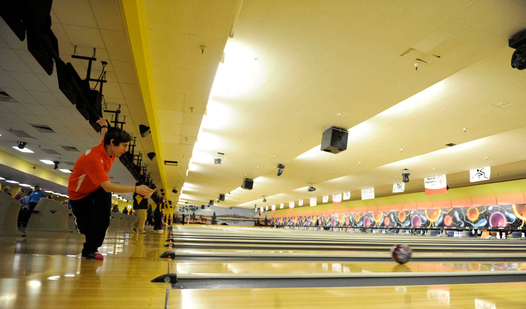JOINT BASE ELMENDORF-RICHARDSON, Alaska -- Rebekah Anderson with the Kodiak Special Olympics bowling team demonstrates her bowling form during the 2012 Special Olympics Bowling tournament at the Polar Bowl Nov. 16. Participants have come from all over Alaska to demonstrate their skills as bowlers. (U.S. Air Force photo/Airman Ty-Rico Lea)