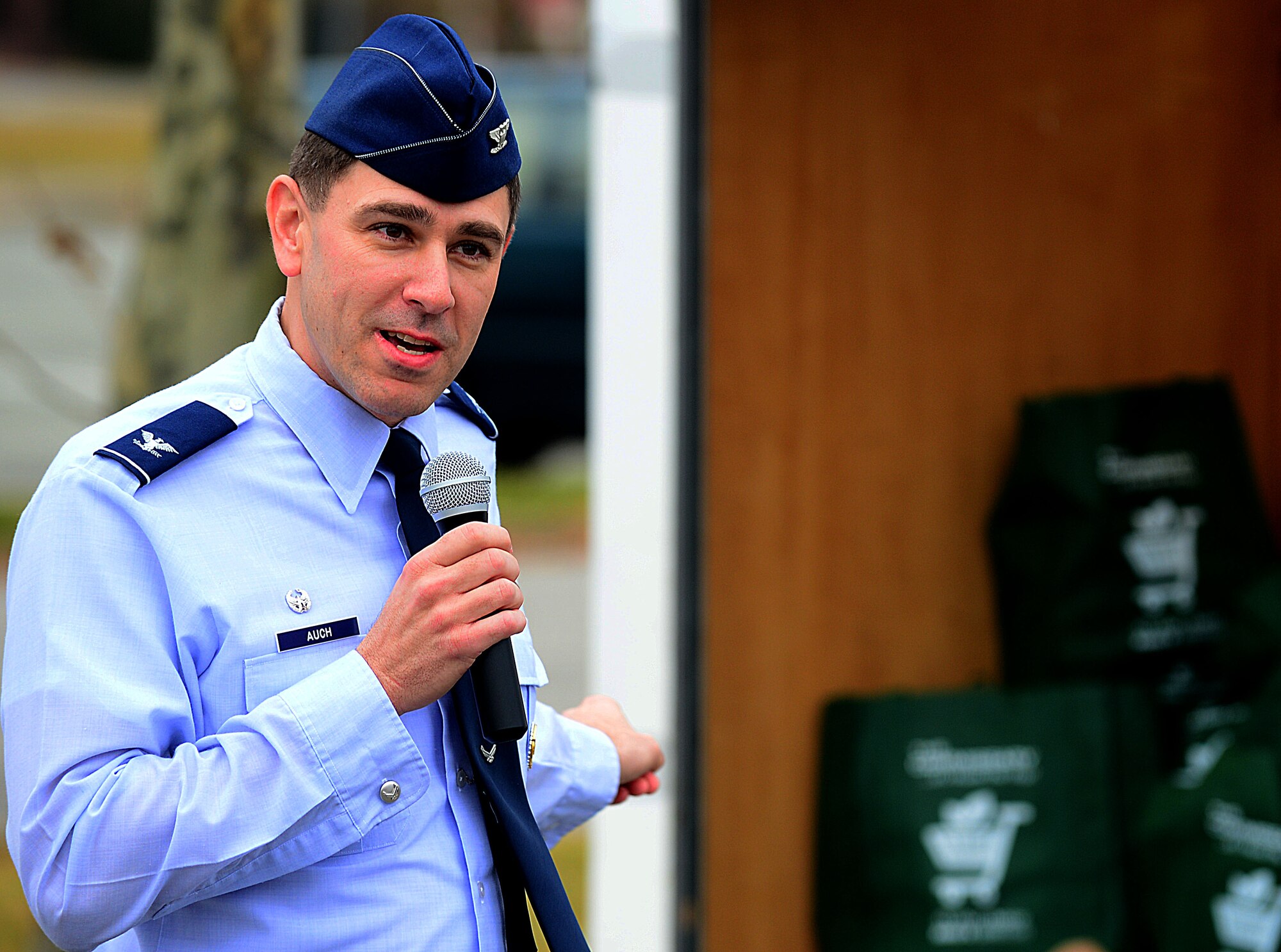 U.S. Air Force Col. Korvin Auch, 633rd Air Base Wing commander, addresses Operation Warmheart volunteers before the distribution of baskets takes place at Langley Air Force Base, Va., Nov. 19, 2012.  Operation Warmheart provides complete Thanksgiving dinners to eligible junior enlisted Airmen and their families during the holiday season. (U.S. Air Force photo by Airman 1st Class Kayla Newman/Released)