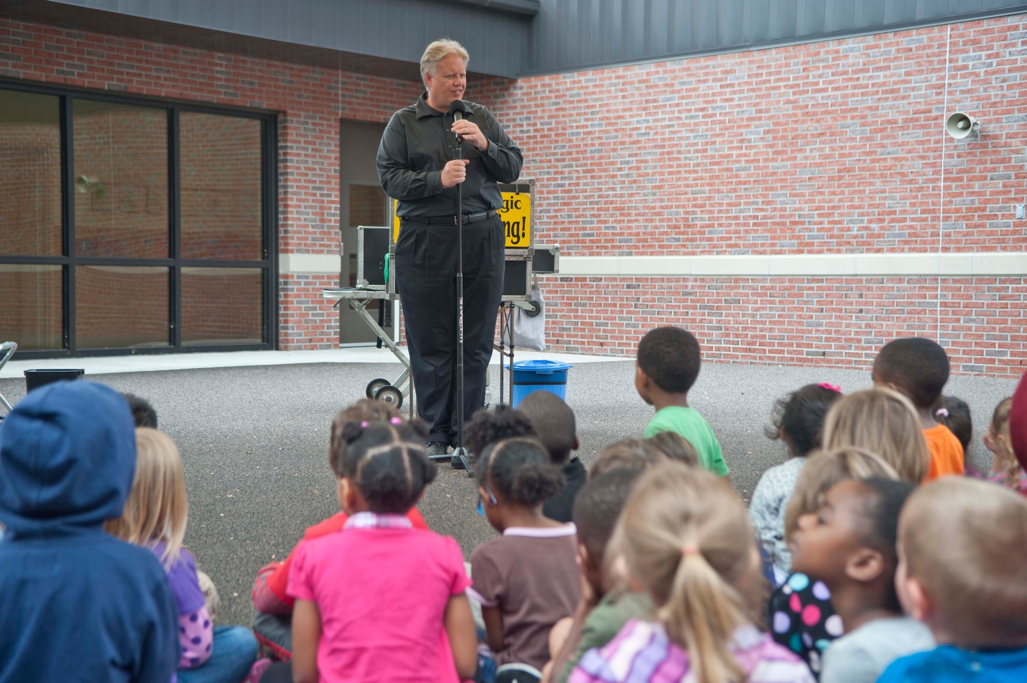 Greg Allen, The Magic of Recycling presenter, searches for a volunteer to help with his first magic trick at the Child Development Center, Moody Air Force Base, Ga., Nov. 13, 2012. Allen visited the CDC to teach children the values of recycling so they can influence their families and other children. (U.S. Air Force photo by Airman 1st Class Paul Francis/Released)
