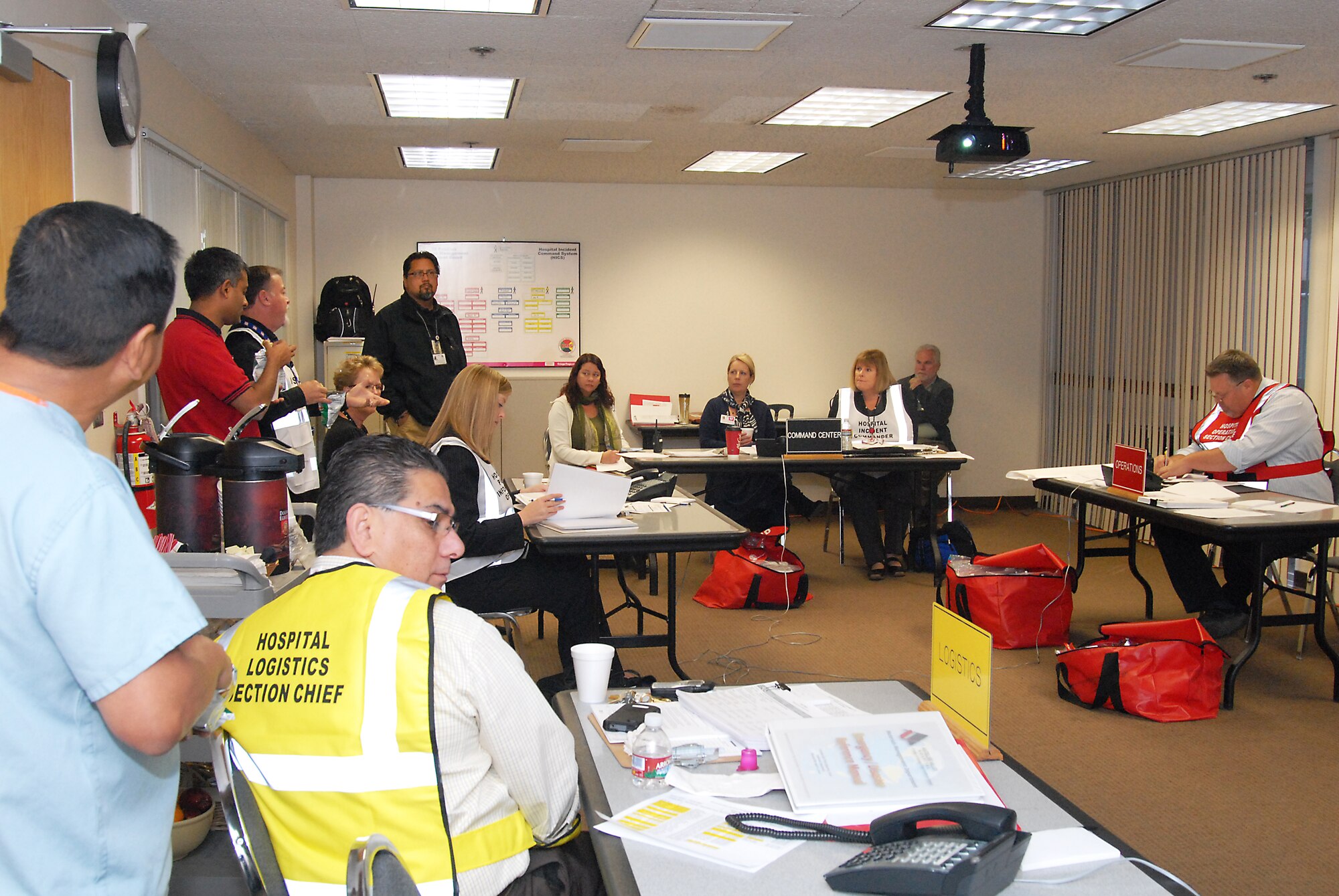 Members of the Antelope Valley Hospital staff work out of their Emergency Operations Center during the California Statewide Medical and Health Training Exercise Program's earthquake response exercise Nov. 16.  Five "wounded" people from Edwards AFB were transported to the hospital for treatment to train on how Edwards and the local community can work together during a natural disaster. (U.S. Air Force photo by Kenji Thuloweit)