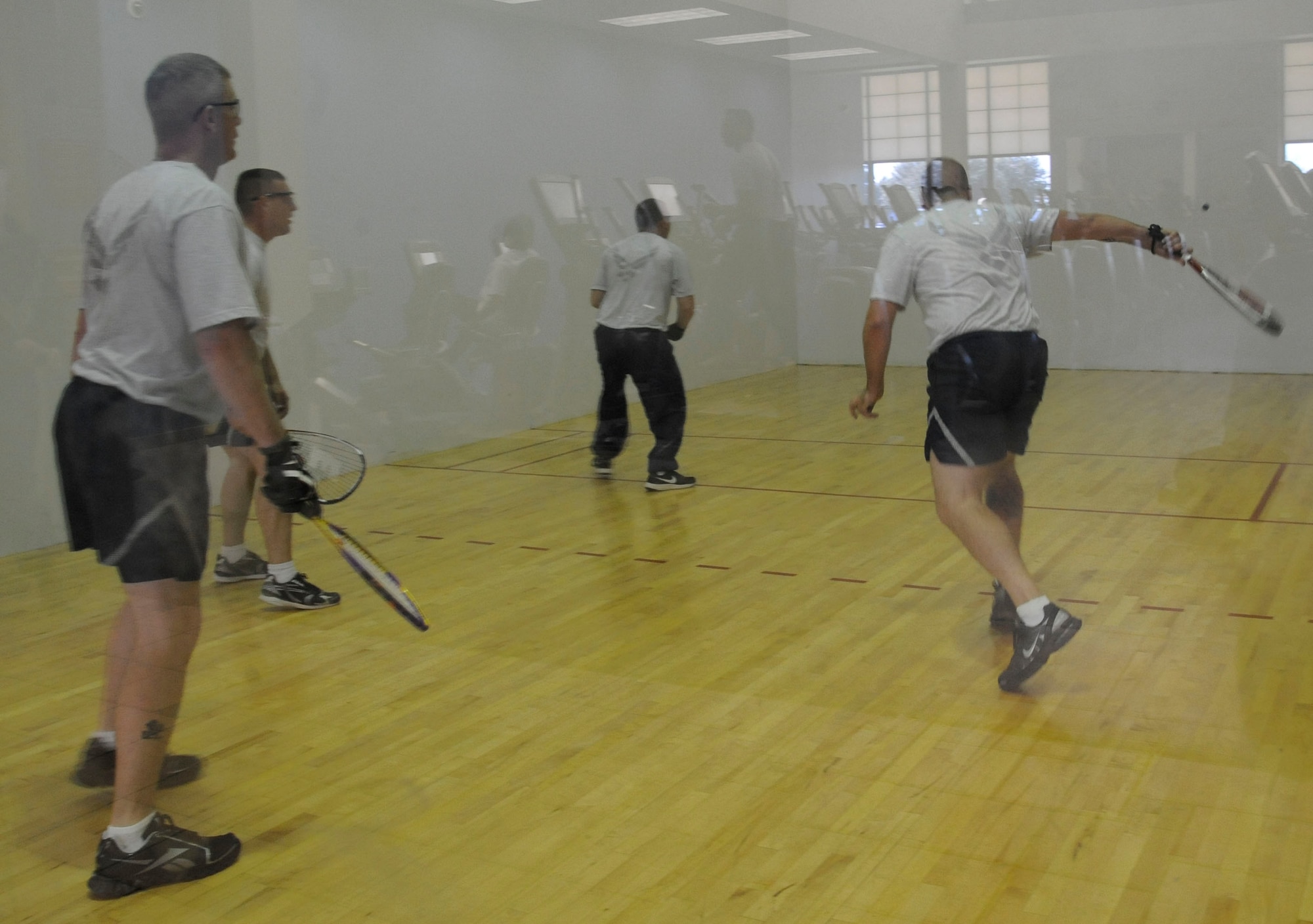 Barksdale Airmen play a game of racquetball during the 2012 Sports Day on Barksdale Air Force Base, La., Nov. 16. Airmen participated in activities such as dodgeball, soccer, basketball, a rucksack relay race, volleyball, flag football and a homerun derby. Sports Day served as a way to promote the importance of fitness and build camaraderie. (U.S. Air Force photo/Airman 1st Class Andrew Moua)(RELEASED)