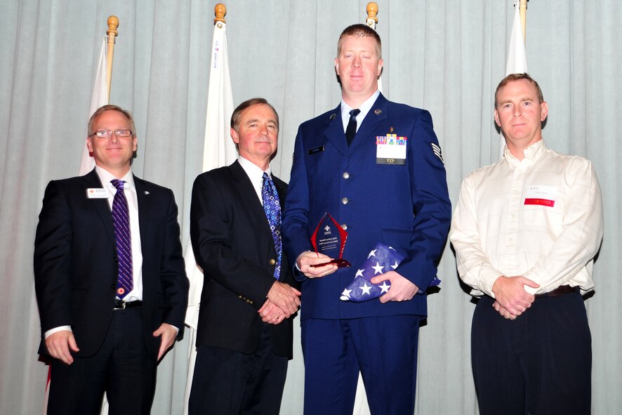 Staff Sgt. Jeffrey Michael Tremel accepts the Wilderness Hero award at the Hometown Heroes luncheon, Nov. 15, 2012. The American Red Cross awards individuals who have made a positive impact on the lives of others, whether through a life-saving action or tireless effort to benefit the community. Tremel is with the 336th Training Support Squadron. (U.S. Air Force photo by Airman 1st Class Taylor Curry)