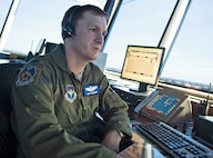 Lt. Col. Tim Cummins, 12th Operations Support Squadron air traffic controller, makes radio contact with inbound   T-38 flights at the east tower Aug. 14 at Joint Base San Antonio-Randolph. (U.S. Air Force photo by Benjamin Faske)