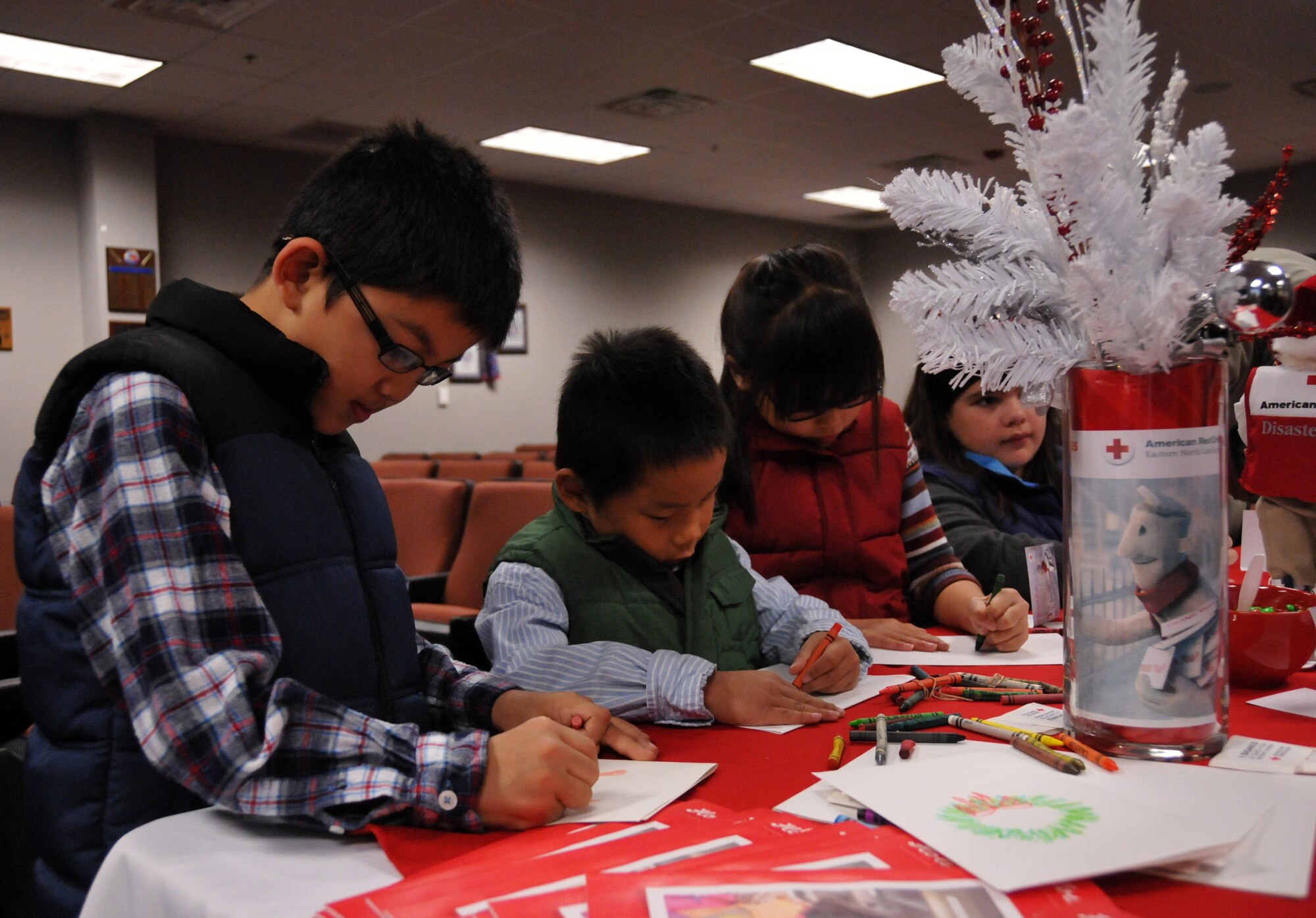 Children of Airmen of the 916th Air Refueling Wing help make and decorate cards as part of the Red Cross Holiday Mail for Heroes event hosted by the wing on Nov. 16, 2012. (USAF photo by Senior Airman Alan Abernethy, 916ARW/PA)