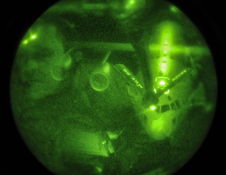 Master Sgt. Ted Buit, the 92nd Operations Group standards evaluations NCO in charge and career boom operator, refuels a C-17 Globemaster III from the 62nd Air Mobility Wing at Joint Base Lewis-McChord, Wash., over Washington and Oregon, Nov. 15, 2012. The night operation provided aerial refueling for a mission essential mobility aircraft and fulfilled Fairchild’s focus on fueling freedom. (U.S. Air Force photo by Senior Airman Benjamin Stratton)