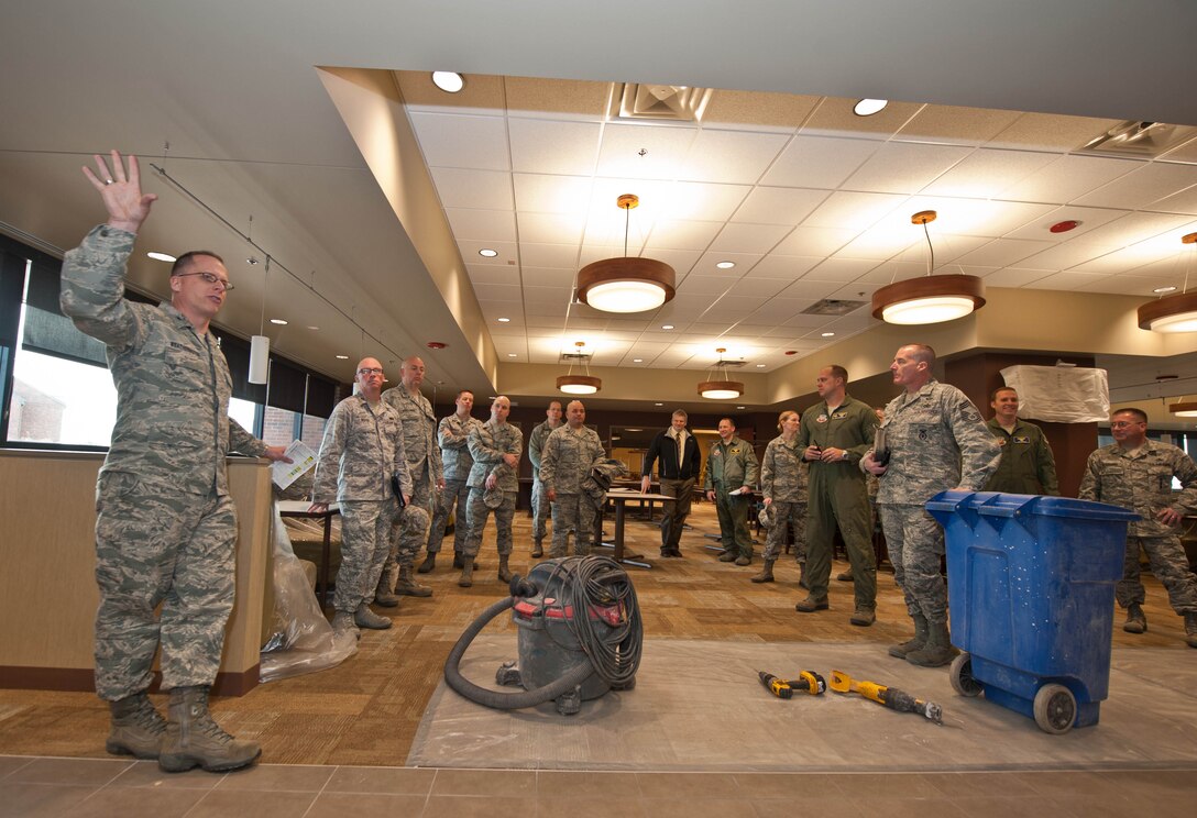 Base leadership discusses the new changes and improvements of the Bandit Inn dining facility during a tour at Ellsworth Air Force Base, S.D., Nov. 14, 2012. The Bandit Inn dining facilities construction project was part of a 4.5 million dollar life cycle renovation to improve and upgrade the facility that was built over 20 years ago. (U.S. Air Force photo by Airman 1st Class Zachary Hada/Released)