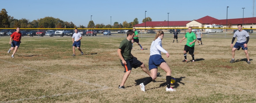 Members of the 2nd Operational Weather Squadron and 2nd Aircraft Maintenance Squadron play soccer during the 2012 Sports Day on Barksdale Air Force Base, La., Nov. 16. Sports Day consists of various team events including dodgeball, basketball, soccer, tug-of-war, volleyball, a homerun derby, flag football and racquetball. This day was designed to improve team work and help increase the awareness of fitness, sports programs and boost morale. (U.S. Air Force photo/ Senior Airman Kristin High)(RELEASED)