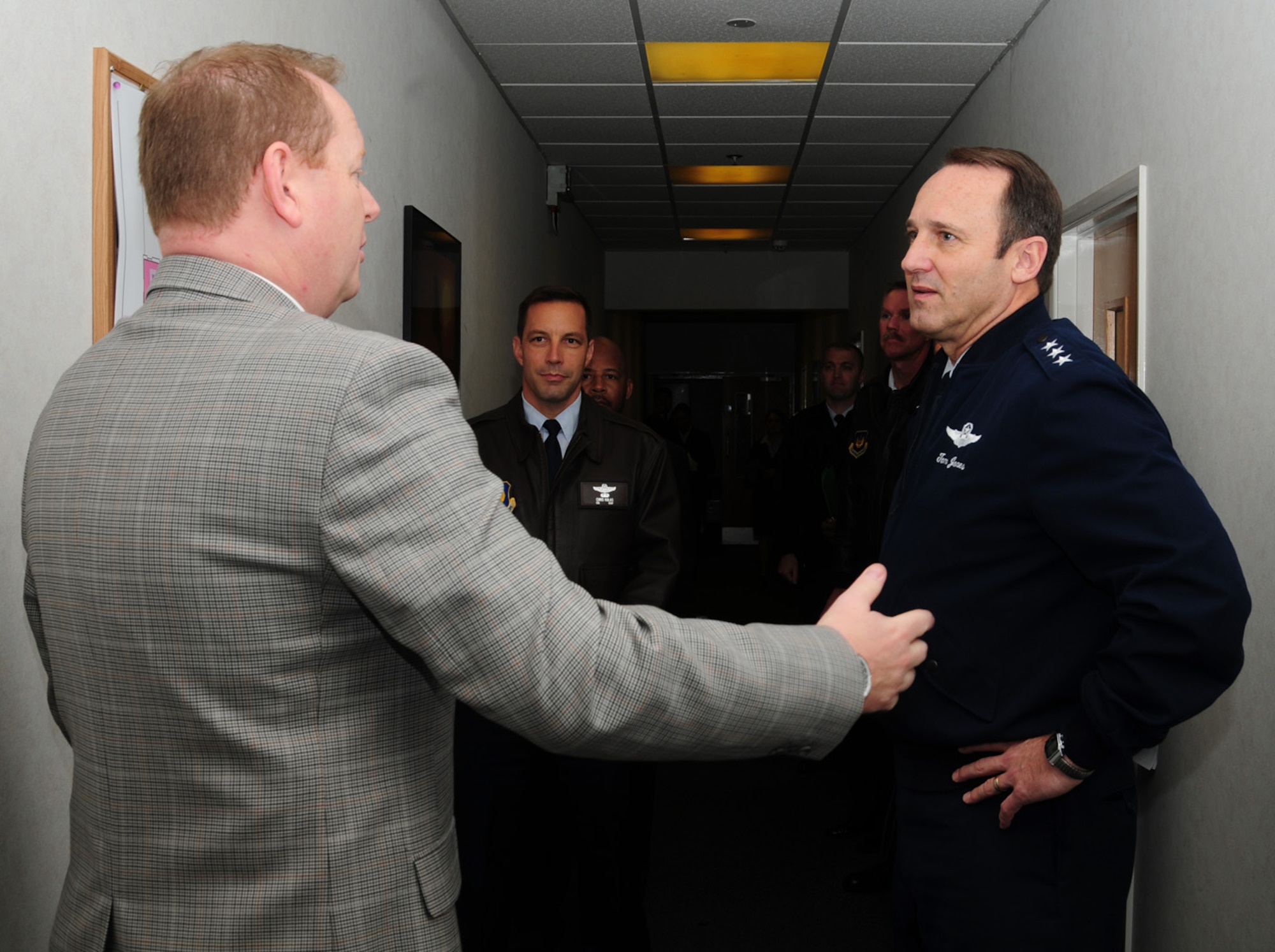 Matt Driver, 100th Force Support Squadron Force Development flight chief, briefs Lt. Gen. N. Tom Jones, U.S. Air Forces in Europe vice commander, on future plans for the current 100th FSS Military Personnel Section building Nov. 19, 2012, at RAF Mildenhall, England. During the general’s visit, he met with military and civilian personnel from around the base, and toured the newly refurbished 100th Logistics Readiness Squadron Vehicle Maintenance facility. Jones also visited RAF Lakenheath. (U.S. Air Force photo by Karen Abeyasekere/released)