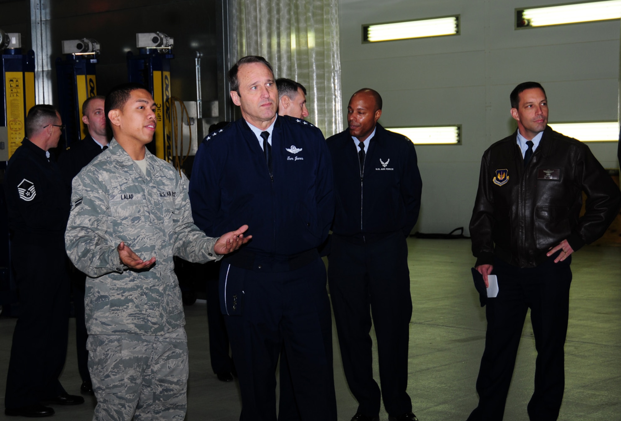 Airman 1st Class Rodel Lalap, 100th Logistics Readiness Squadron, briefs Lt. Gen. N. Tom Jones, U.S. Air Forces in Europe vice commander, Ramstein Air Base, Germany, at the vehicle maintenance compound, Nov. 19, 2012, at RAF Mildenhall, England. During his visit to the base, the general also visited the 100th Force Support Squadron and 100th Comptroller Squadron, as well as attending briefings with 100th Air Refueling Wing leadership. The general also visited RAF Lakenheath. (U.S. Air Force photo by Karen Abeyasekere/released)