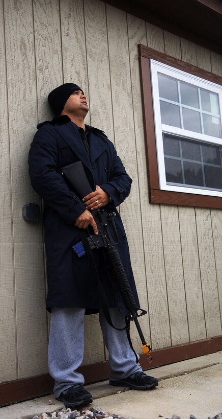 Master Sgt. Scott Wagonblott, 633rd Air Base Wing information assurance manager, plays the role of active shooter during a training exercise at Langley Air Force Base, Va., Nov. 15, 2012.  Wagonblott said changing his demeanor to prepare for the role of active shooter had effects on his coworkers and his family. (U.S. Air Force photo by Staff Sgt. Katie G. Ward / Released)