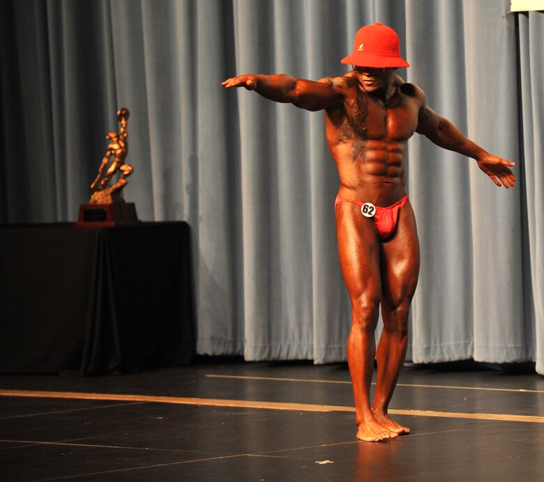 U.S. Air Force Master Sgt. LaJuan Fuller, 366th Civil Engineer Squadron first sergeant, performs his routine during the evening portion of a body building competition April 28, 2012, in Boise, Idaho. Fuller’s wife, two sons and friends came out to watch the evening performance where the competitors chose a song and showed off different poses throughout the performance. (U.S. Air Force photo/Airman 1st Class Heather Hayward)