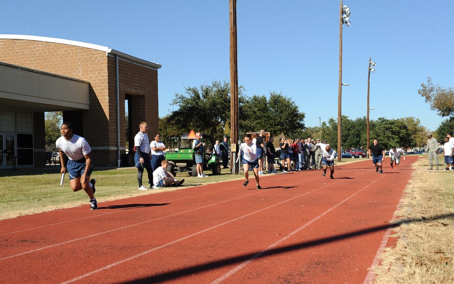 Barksdale Airmen compete in a 4x100 relay race during the 2012 Sports Day on Barksdale Air Force Base, La., Nov. 16. The annual event gave Airmen the opportunity to participate in several individual and team sports throughout the day boosting morale. (U.S. Air Force photo/Airman 1st Class Benjamin Gonsier)(RELEASED)
