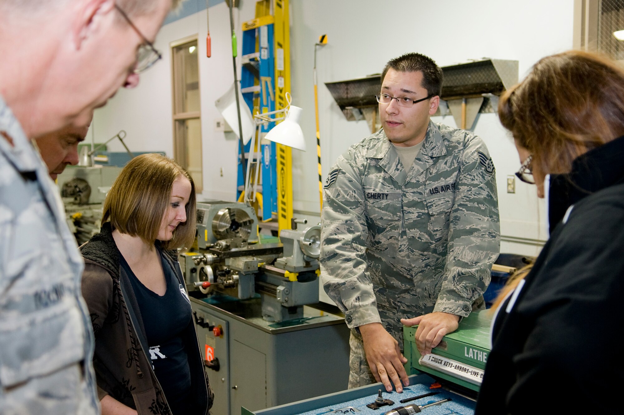 Staff Sgt. Shawn Cherty, 434th Maintenance Squadron metals technology specialist, explains to Grissom's honorary commanders how every tool in his shop has its place during a tour of Grissom's maintenance facilities recently. (U.S. Air Force photo/ Tech. Sgt. Mark Orders-Woempner)

